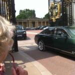 Me, Mum and The Queen - outside Buckingham Palace - yes, it really is Her Majesty behind the glass!